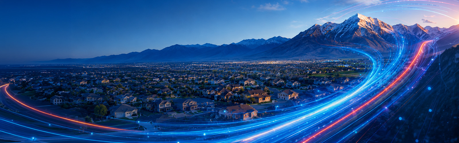 Panoramic nighttime view of Eagle Mountain, Utah, with neighborhoods beneath a glowing mountain range and bright Direct Communications fiber-optic light trails sweeping across the city skyline.